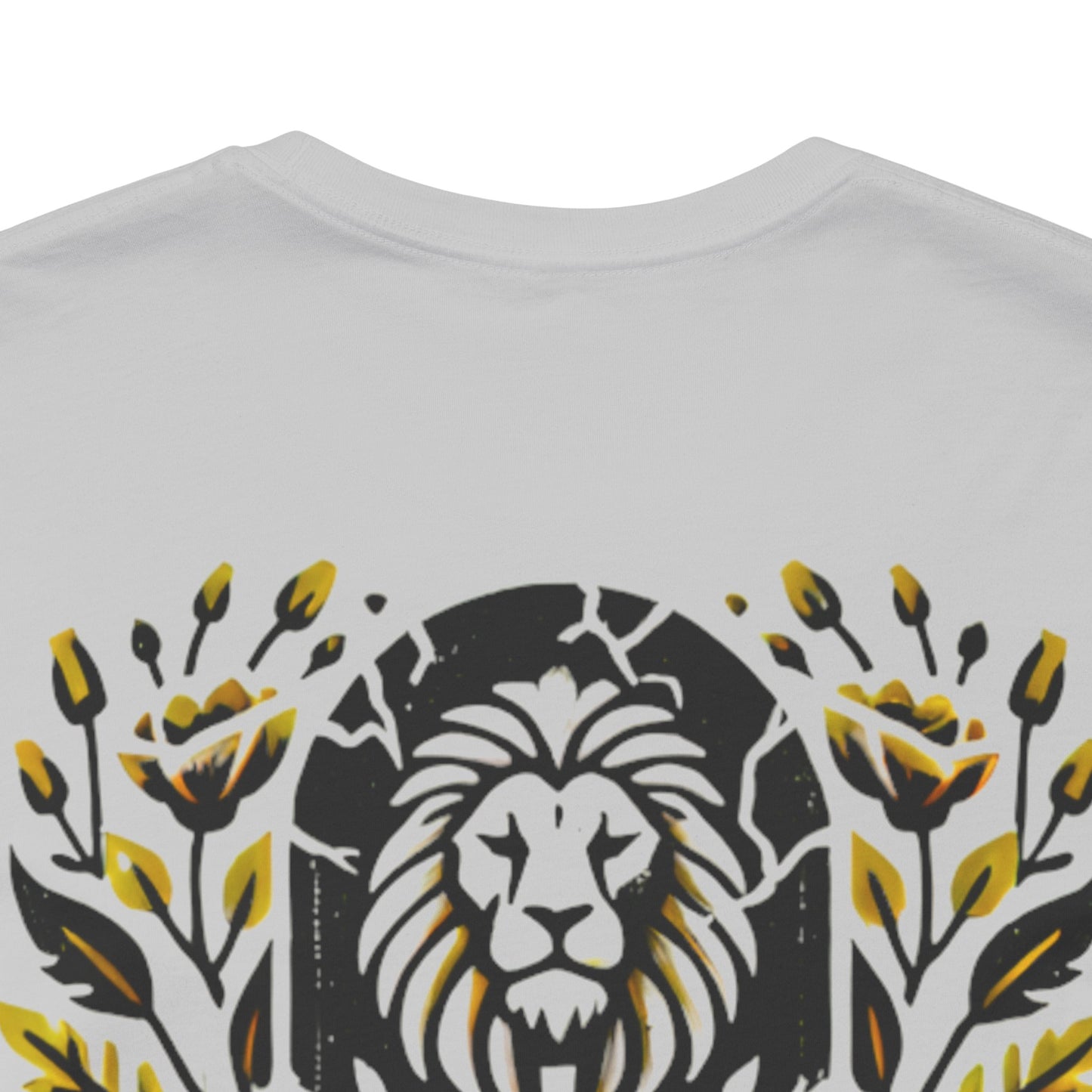 Close-up of the 'Death Defeated' T-shirt design in Solid Athletic Grey, showcasing a bold lion graphic with vibrant yellow floral details and cracked stone effects.