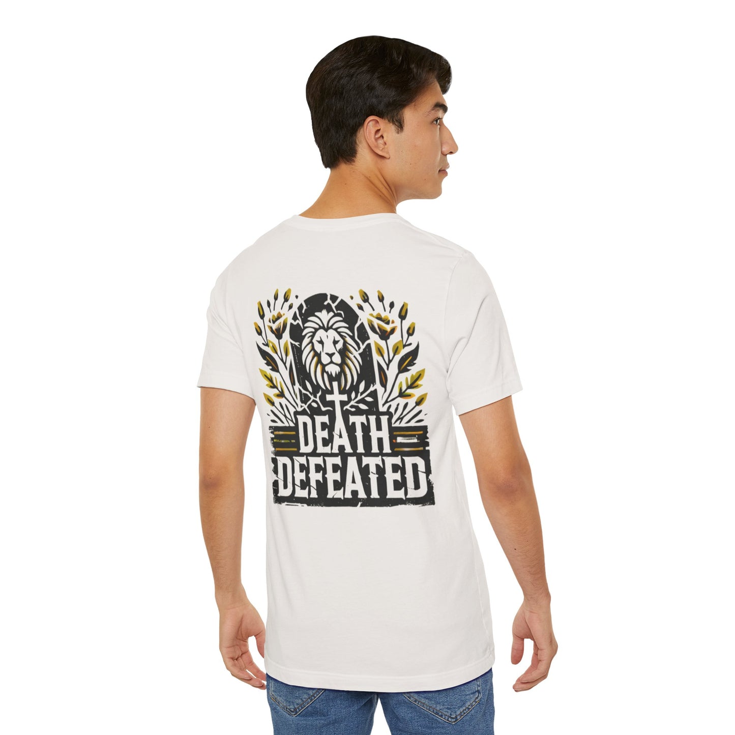 Model wearing the 'Death Defeated' T-shirt in Vintage White, showcasing the back design with a bold lion graphic, cross, vibrant yellow floral accents, and 'Death Defeated' text.