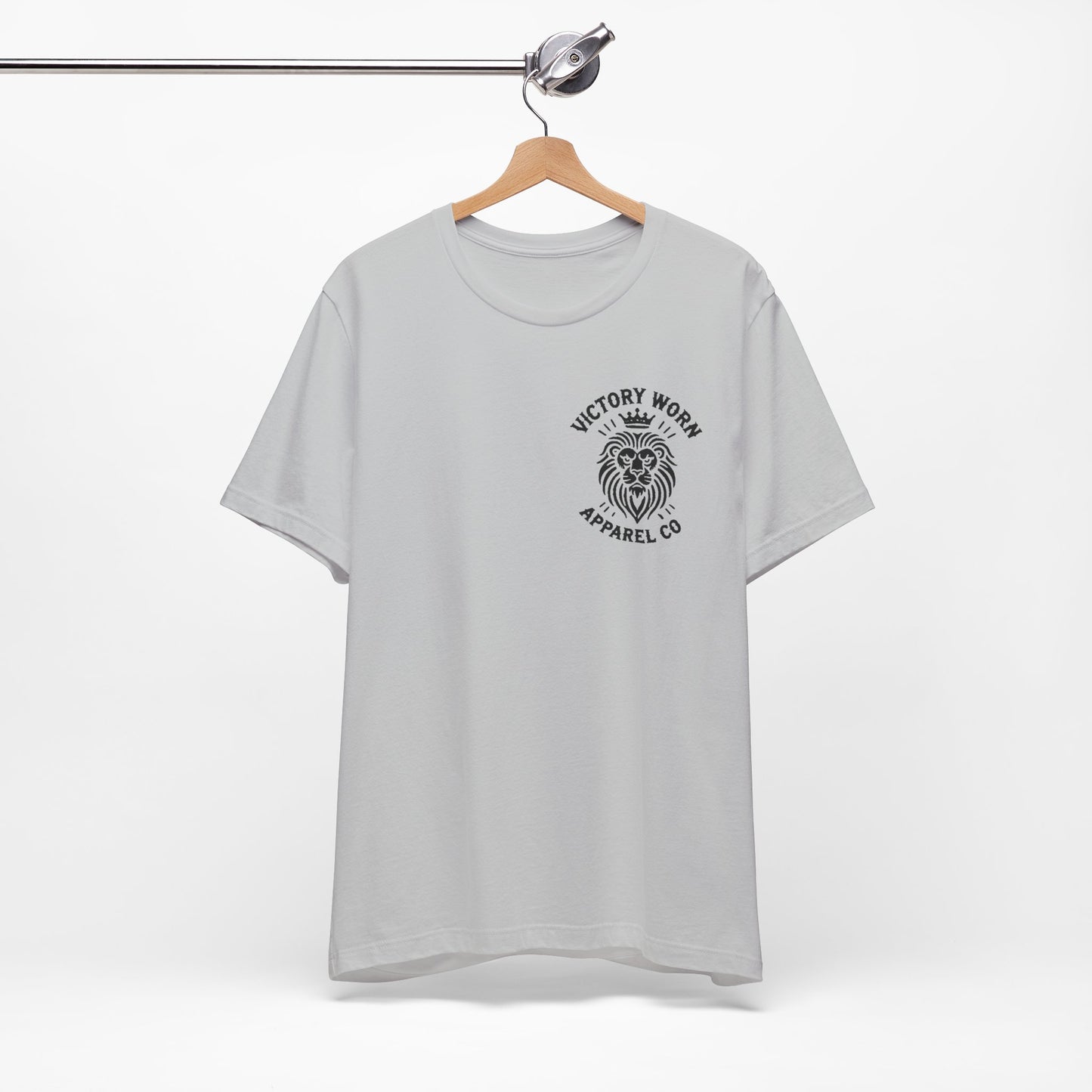 Death Defeated' T-shirt in Solid Athletic Grey, featuring the Victory Worn Apparel Co. lion logo on the front, hanging on a wooden hanger against a clean white background.