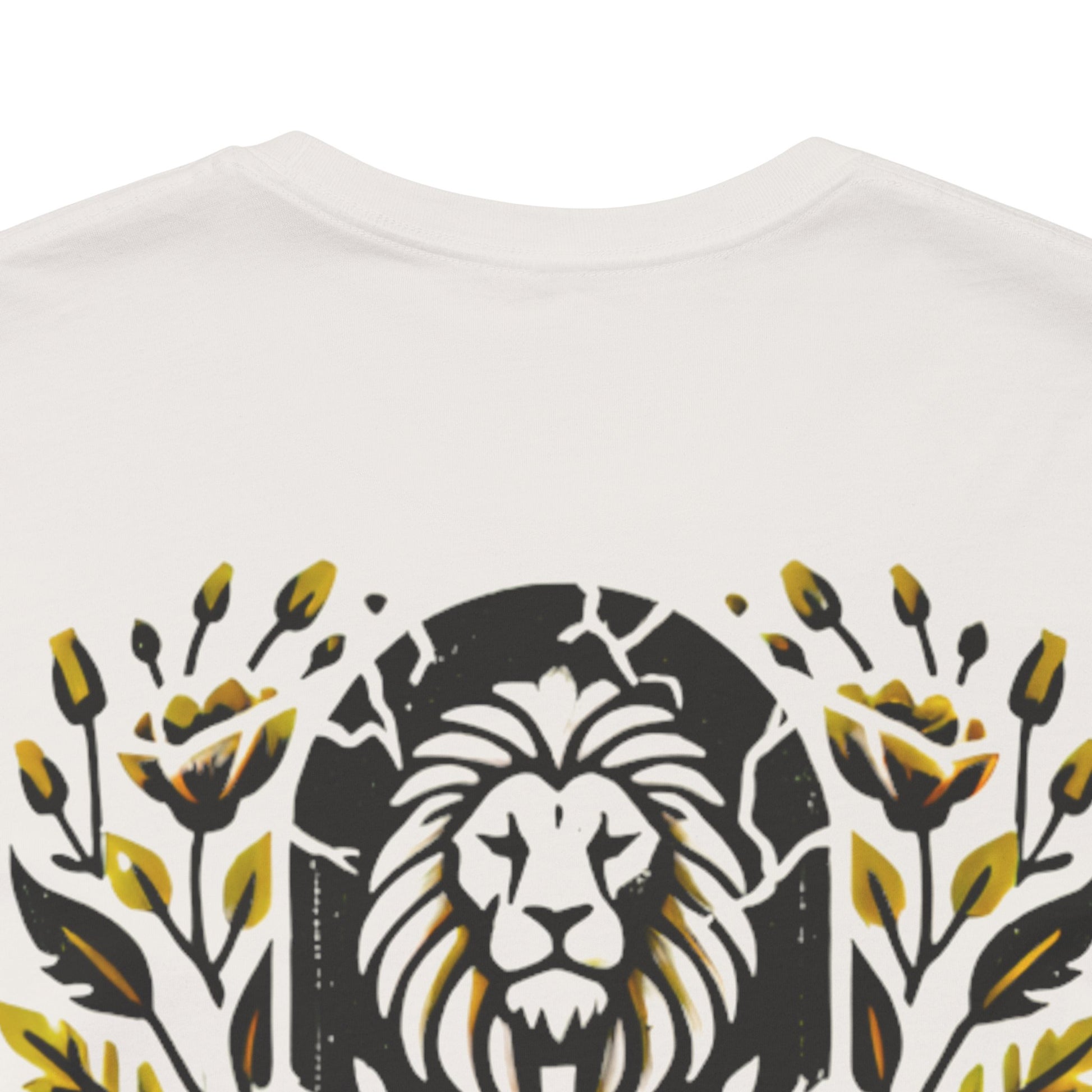 Close-up of the 'Death Defeated' T-shirt design in Vintage White, showcasing a bold lion graphic with vibrant yellow floral details and cracked stone effects.