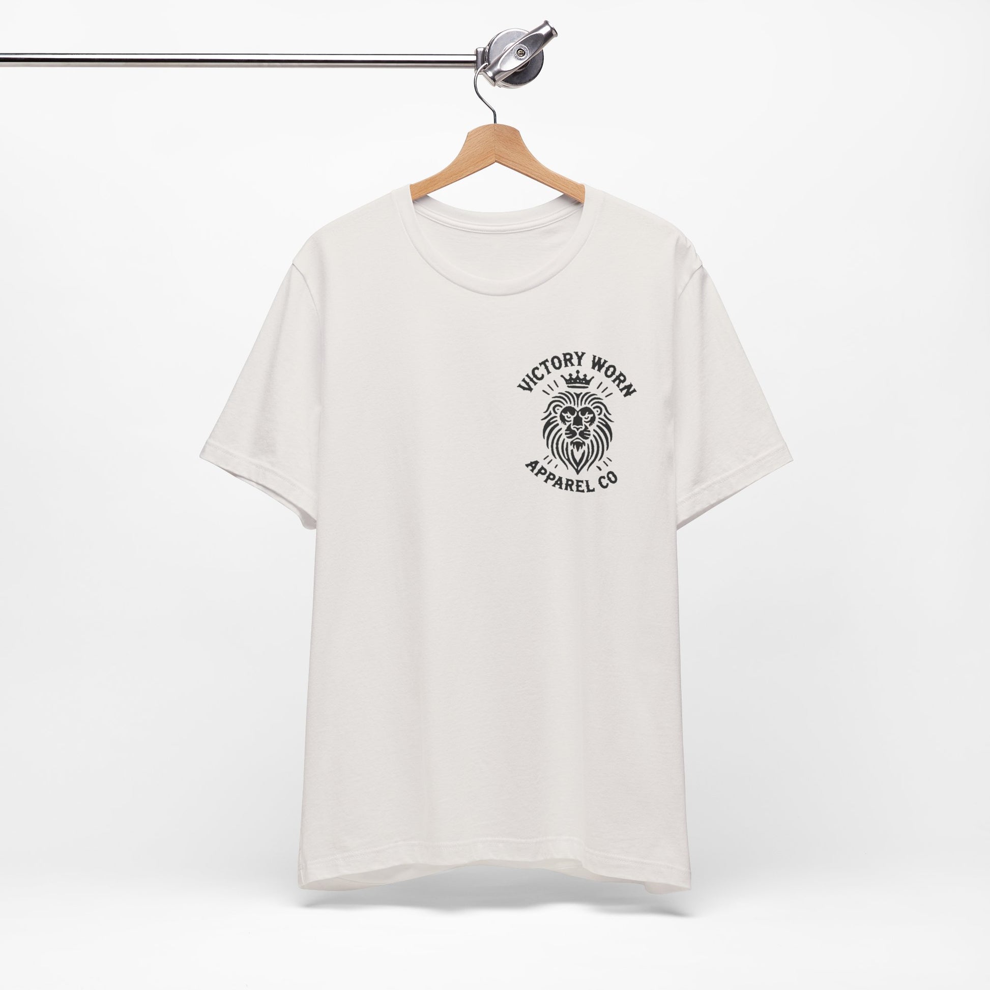 Death Defeated' T-shirt in Vintage White, featuring the Victory Worn Apparel Co. lion logo on the front, hanging on a wooden hanger against a clean white background.